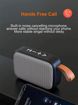 Portable Bluetooth mini speaker with built-in microphone for hands-free calls and noise cancellation features.