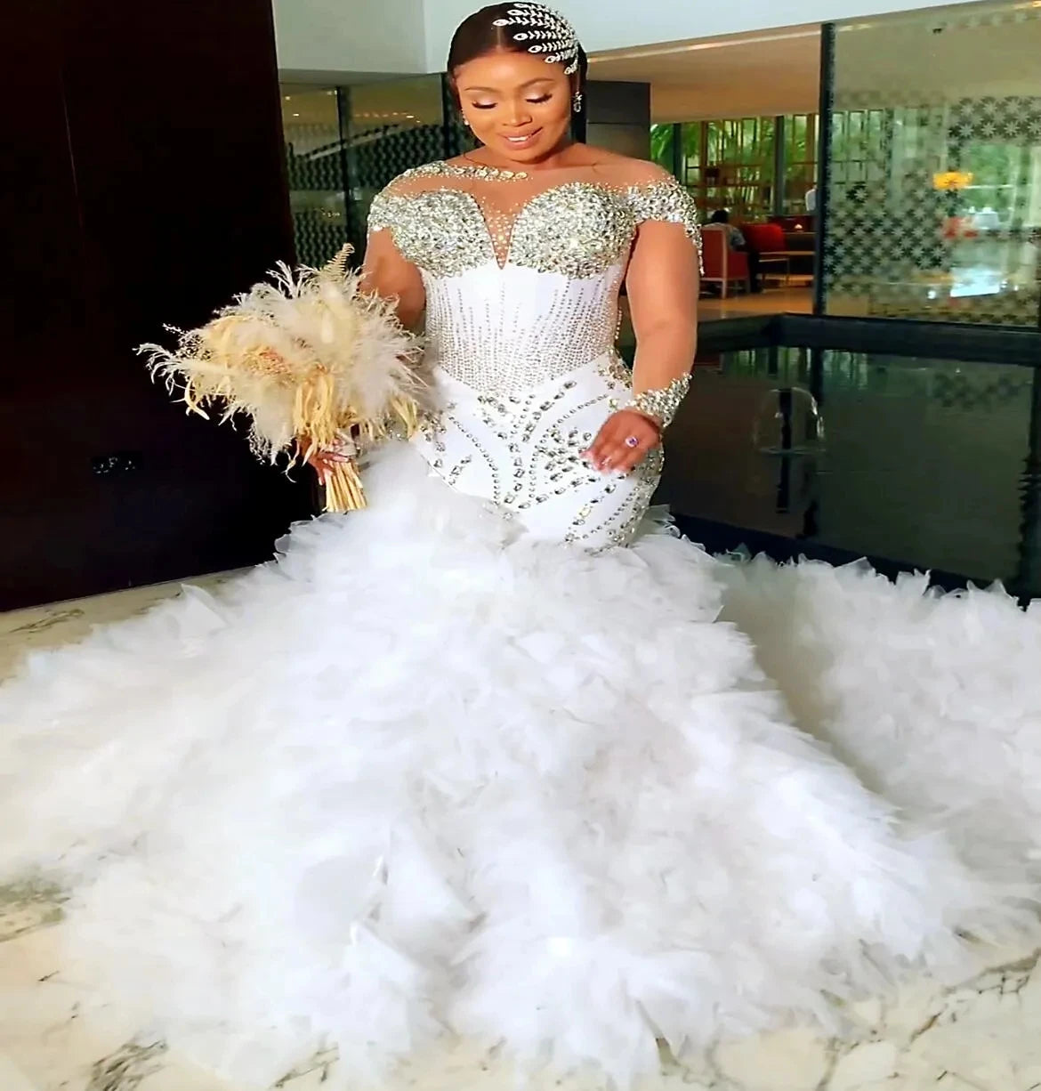 Elegant white plus size Arabic mermaid wedding dress with tulle skirt and crystal embellishments.