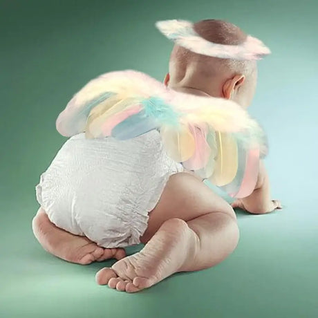Baby in angel wings and headband, perfect for newborn photography props and costumes for 0-12 months.
