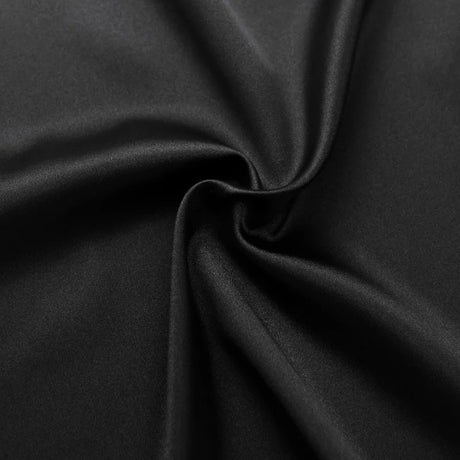 Close-up of luxurious black satin fabric, showcasing its smooth texture and elegant drape.