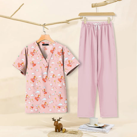 Cartoon print dental scrubs for women featuring a V-neck top and pink pants, ideal for pet grooming workwear.