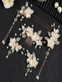 Elegant floral hair accessories set featuring white blossoms and pearls for wedding and special occasions.