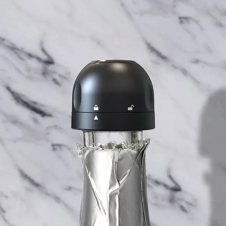 Vacuum red wine bottle cap stopper with silicone seal, designed for freshness and easy use on a glass bottle.