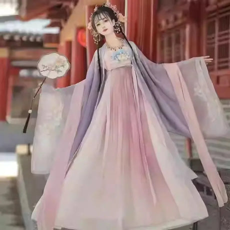 Hanfu traditional dress for women, elegant party outfit in pastel colors with floral details, made of polyester.