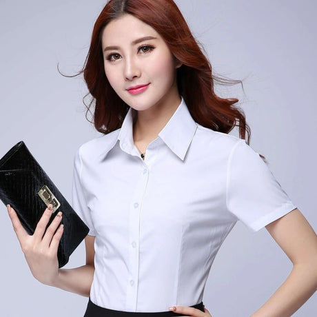 Model wearing a white short sleeve shirt, showcasing youthful office style and slim fit design.