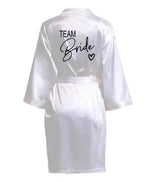 White satin robe with 'TEAM Bride' text on the back, perfect for bridal parties.