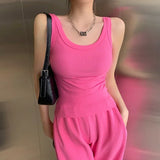 RetroRib™ 90s vintage ribbed tank top in vibrant pink, showcasing a sleeveless streetwear style.