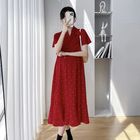 Red polka dot Korean maternity dress with short sleeves and V-neck, perfect for summer wear.