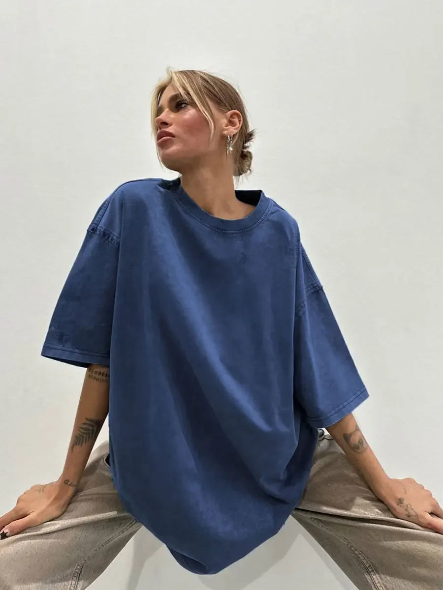 Casual blue oversized t-shirt in cotton worn by a model, perfect for women seeking comfort and style.