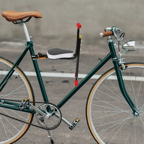 Kids Electric Saddle for bicycles, featuring a comfortable backrest and sleek design on a green bike.