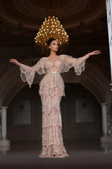 Elegant Arabic nude stone wedding gown with tiered sleeves and sweetheart neckline, featuring intricate beading and floor-length design.