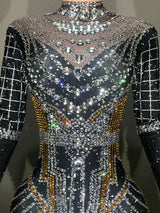 Rhinestone jumpsuit featuring an intricate design, perfect for stage performances and nightclubs, made of polyester and spandex.