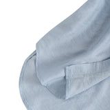 Close-up of soft blue fabric illustrating the breathable texture of ZanzeaEase™ oversized summer blouse.