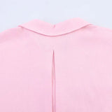 Back view of a pink AsymLinen™ wide sleeve linen shirt featuring a turn-down collar and a stylish split design.