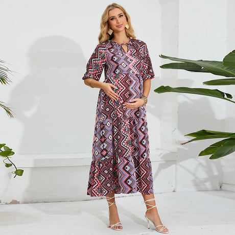 Elegant beach maternity dress with geometric pattern, perfect for summer photoshoots and expectant mothers.