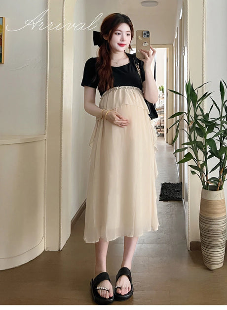 Maternity dress for summer, featuring a short sleeve design and a comfortable fit for expectant mothers.