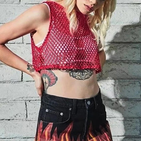 Model wearing red MeshGlow™ hollow-out summer crop top with fishnet design, showcasing a casual summer style.