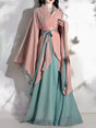 Model wearing a pink and green Hanfu vintage cosplay costume with flowing sleeves, showcasing traditional Chinese attire.