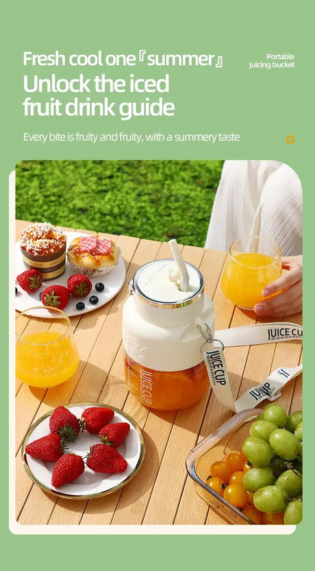 Fresh fruit drinks served with a wireless portable juicing bucket and summer fruits on a picnic table.