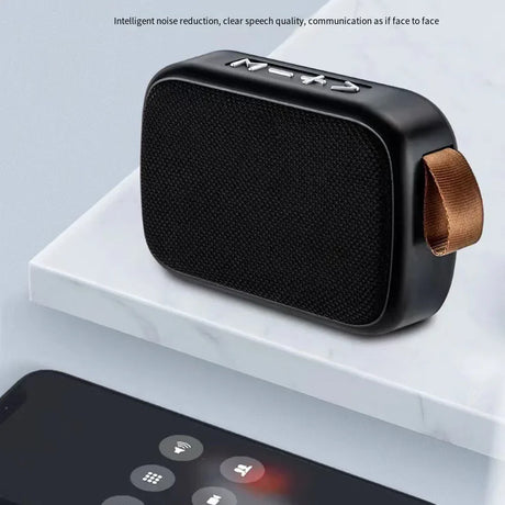 Portable Outdoor Bluetooth 5.0 Mini Speaker with intelligent noise reduction and clear sound quality on a marble surface.