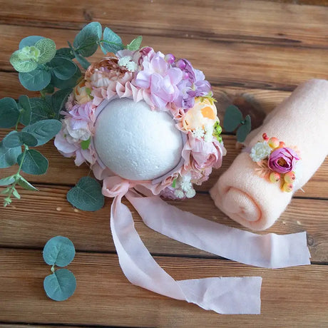 Newborn stretch knit mohair set with floral bonnet and peach wrap, perfect for baby photography props.