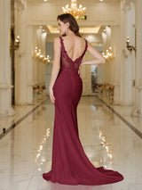 Elegant burgundy evening dress featuring a stunning back design with lace detail and a flattering fit.