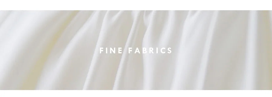 Close-up of fine satin fabric showcasing smooth texture and draping for elegant designs.