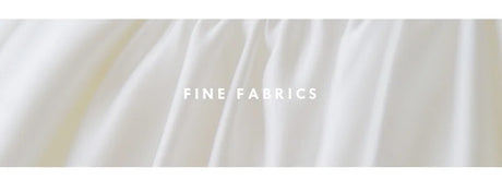 Close-up of fine satin fabric showcasing smooth texture and draping for elegant designs.