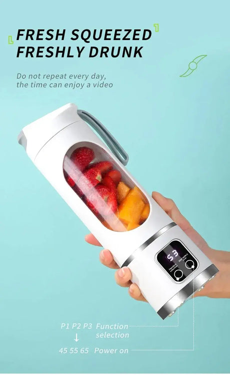 Portable fruit juicer with 450ml capacity, showcasing fresh fruits ready for blending and automatic pulp ejection function.