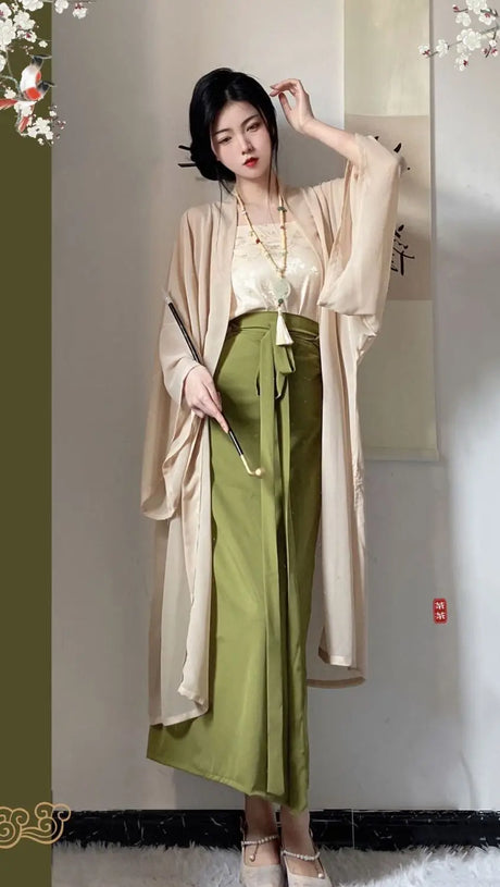 Elegant woman wearing a Princess Song Dynasty Hanfu 3-piece robe, featuring a flowing beige outer layer and green trousers.