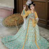 Woman in a Tang Suit Hanfu dress with floral details, holding a fan, perfect for Halloween cosplay.