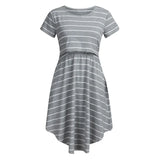 Striped multifunctional nursing dress in gray, featuring a relaxed silhouette and knee-length design for maternity wear.