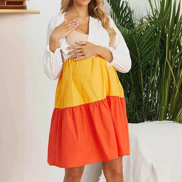V-neck color contrast maternity dress with long sleeves in yellow and orange, designed for summer and breastfeeding.