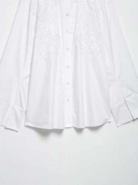 Elegant white embroidery shirt with long sleeves, stand collar, and button closure for casual wear.