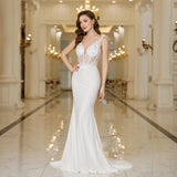 Elegant MisShow white mermaid wedding dress with lace and pearls, featuring a fitted silhouette and intricate floral details.