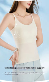 Woman wearing BraChic Ice Silk Cami top, showcasing built-in bra and side closing feature in a light color.