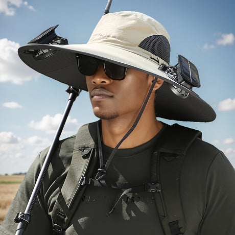 Man wearing a sporty men's sun hat with solar fans, sunglasses, and a fishing rod against a cloudy sky.