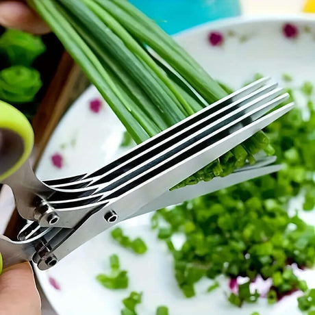 Durable stainless steel kitchen scissors cutting green onions for food preparation, ambidextrous design.