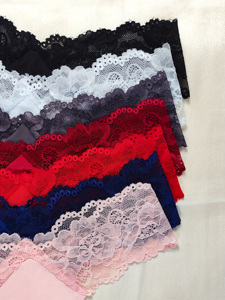 Colorful lace trims in black, grey, navy, red, pink, showcasing delicate floral patterns and textures.
